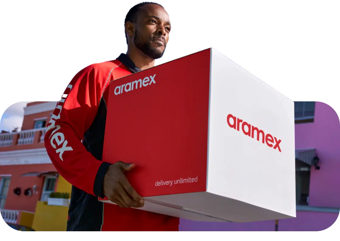 Aramex courier carrying a delivery box